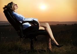 Business Woman in Chair with Sunset